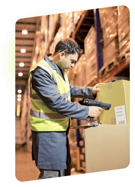 warehouse worker scanning a shipping box label